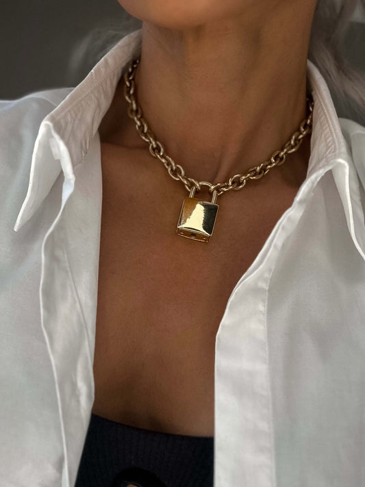 chain necklace with a padlock pendant